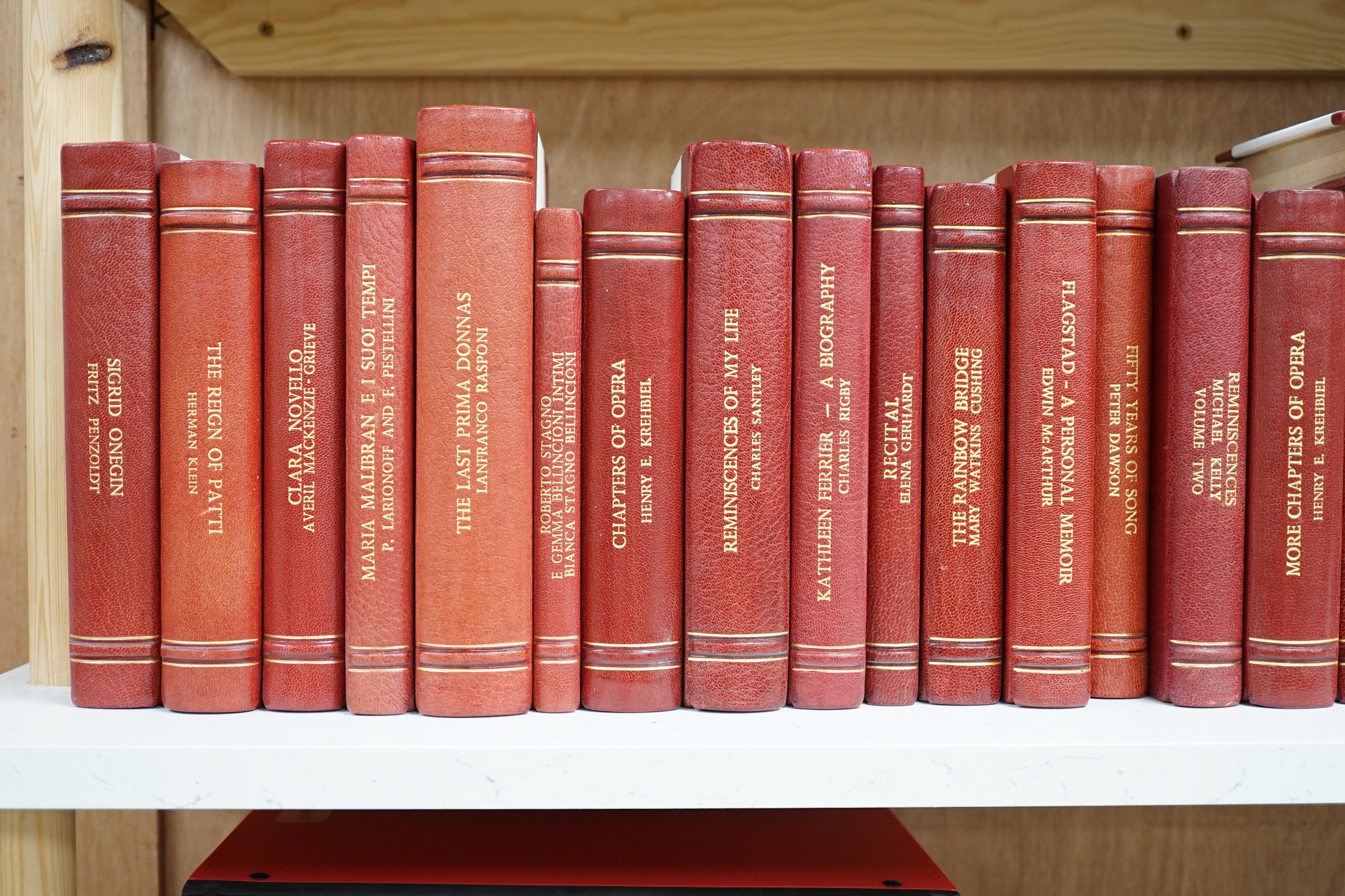 A collection of 19th and 20th century works on opera related biographies, autobiographies and histories, bound in red morocco by EA Weeks, London, one signed by the author, approx. 69 in total. Please note :- A SIMILAR L